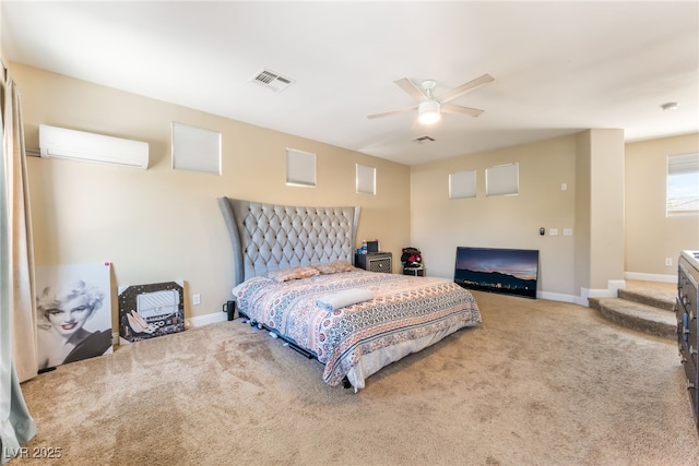 2912 Hot Cider Ave, North Las Vegas, NV 89031 - bedroom featuring a wall mounted air conditioner, carpet floors, and ceiling fan