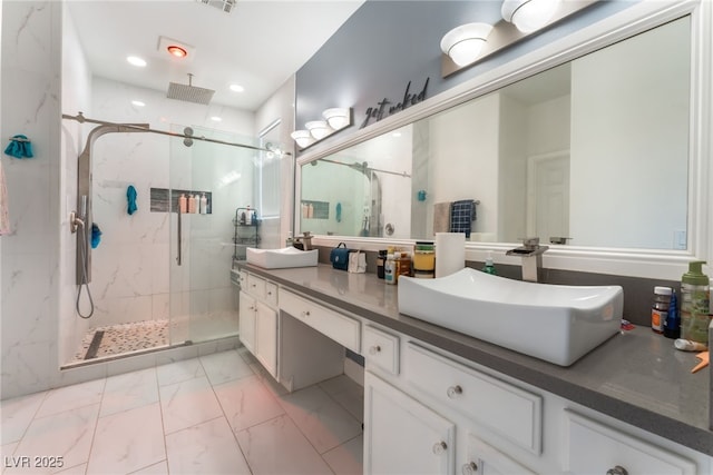 2912 Hot Cider Ave, North Las Vegas, NV 89031 - bathroom featuring a marble finish shower, double vanity, marble look tile flooring, and recessed lighting