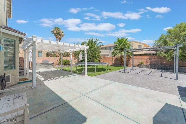 2912 Hot Cider Ave, North Las Vegas, NV 89031 - fenced backyard with a pergola, a patio, and a trampoline