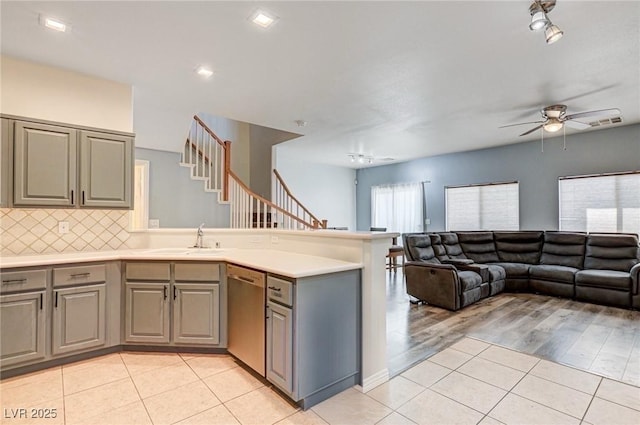 1073 Pleasure Ln Unit 2, Henderson, NV 89002 - kitchen with dishwasher, gray cabinetry, light tile patterned floors, a ceiling fan, and open floor plan