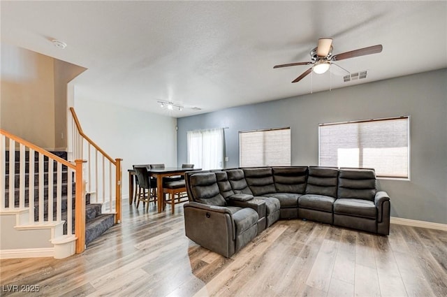 1073 Pleasure Ln Unit 2, Henderson, NV 89002 - living area featuring ceiling fan, light wood-style floors, and stairs