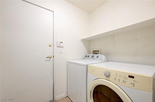 1073 Pleasure Ln Unit 2, Henderson, NV 89002 - laundry room with washing machine and clothes dryer and light tile patterned floors