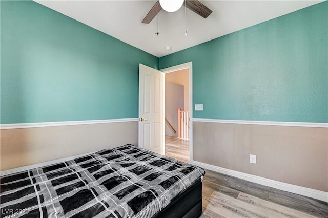 1073 Pleasure Ln Unit 2, Henderson, NV 89002 - bedroom with wood finished floors and a ceiling fan