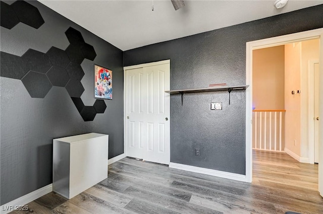 1073 Pleasure Ln Unit 2, Henderson, NV 89002 - unfurnished room with wood finished floors, a textured wall, and ceiling fan