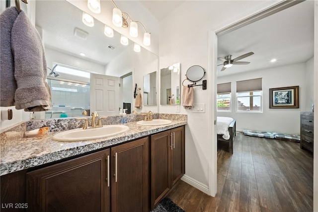 3603 E Umatilla Ave, Pahrump, NV 89061 - bathroom with healthy amount of natural light, double vanity, connected bathroom, and ceiling fan