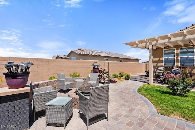 3603 E Umatilla Ave, Pahrump, NV 89061 - fenced backyard featuring a pergola, a patio, and an outdoor fire pit