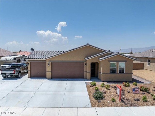 3603 E Umatilla Ave, Pahrump, NV 89061 - single story home featuring an attached garage, stucco siding, driveway, and a tile roof