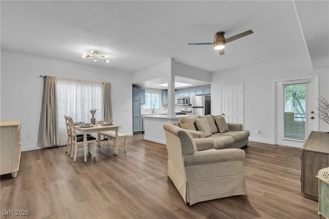 833 Aspen Peak Loop Unit 613, Henderson, NV 89011 - living room with wood finished floors and a ceiling fan
