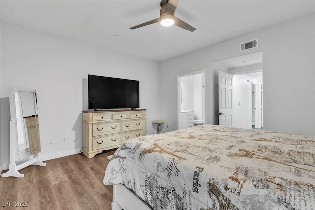 833 Aspen Peak Loop Unit 613, Henderson, NV 89011 - bedroom featuring wood finished floors, connected bathroom, and ceiling fan
