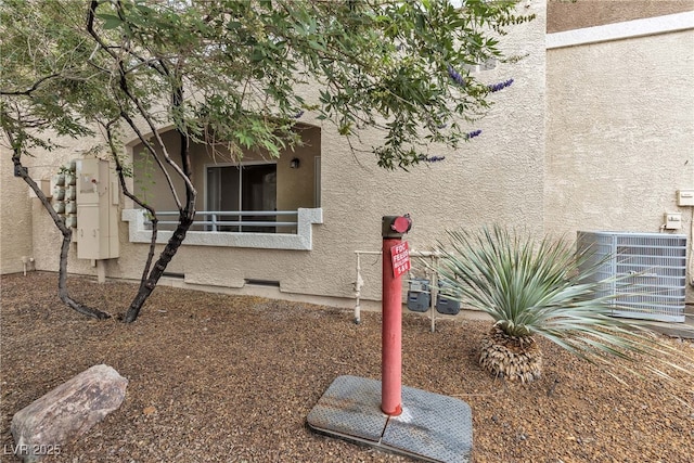 833 Aspen Peak Loop Unit 613, Henderson, NV 89011 - view of side of property featuring stucco siding and a cooling unit