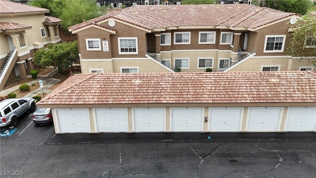 833 Aspen Peak Loop Unit 613, Henderson, NV 89011 - view of front of property featuring community garages and stucco siding
