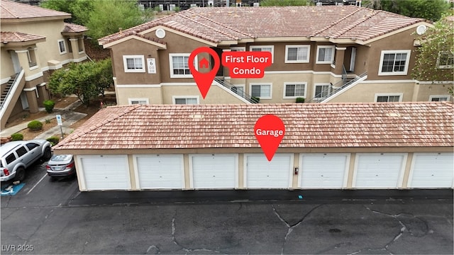 833 Aspen Peak Loop Unit 613, Henderson, NV 89011 - view of front facade with community garages and stucco siding