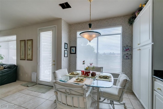 7836 Silver Plateau Ave, Las Vegas, NV 89128 - dining room featuring light tile patterned flooring, healthy amount of natural light, and wallpapered walls