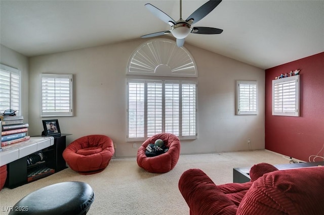 7836 Silver Plateau Ave, Las Vegas, NV 89128 - carpeted living room featuring vaulted ceiling, ceiling fan, and plenty of natural light