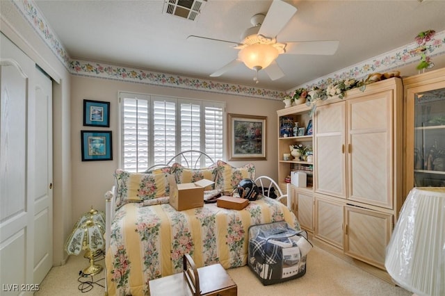7836 Silver Plateau Ave, Las Vegas, NV 89128 - carpeted bedroom with a ceiling fan and a closet