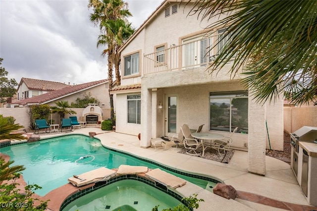 7836 Silver Plateau Ave, Las Vegas, NV 89128 - view of pool with a patio, a fenced backyard, a pool with connected hot tub, and area for grilling