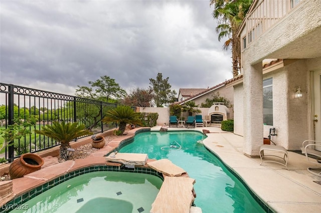 7836 Silver Plateau Ave, Las Vegas, NV 89128 - view of pool featuring a patio area, a fenced backyard, and a pool with connected hot tub