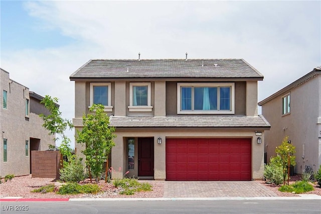 8478 Hawks View St, Las Vegas, NV 89113 - view of front of home featuring a garage, decorative driveway, and stucco siding