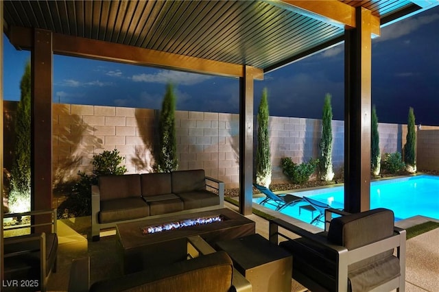8478 Hawks View St, Las Vegas, NV 89113 - fenced backyard featuring an outdoor living space with a fire pit and a patio area