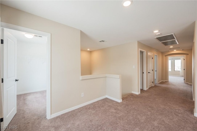 8478 Hawks View St, Las Vegas, NV 89113 - corridor with an upstairs landing, carpet flooring, recessed lighting, and arched walkways