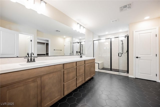 8478 Hawks View St, Las Vegas, NV 89113 - bathroom with double vanity, a stall shower, tile patterned floors, and recessed lighting
