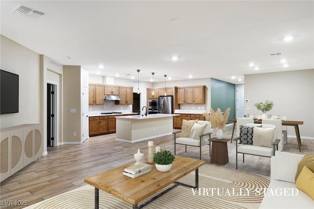 8478 Hawks View St, Las Vegas, NV 89113 - living room with light wood finished floors and recessed lighting