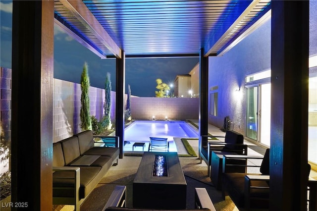 8478 Hawks View St, Las Vegas, NV 89113 - pool at twilight with an outdoor living space with a fire pit, a patio area, and a fenced backyard