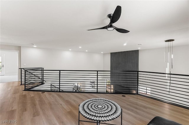 10707 Sleepy Mist Ct, Las Vegas, NV 89141 - unfurnished room with an upstairs landing, ceiling fan, wood finished floors, and recessed lighting