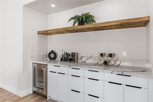 10707 Sleepy Mist Ct, Las Vegas, NV 89141 - indoor bar featuring beverage cooler, light wood-type flooring, and recessed lighting