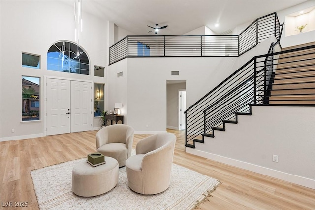 10707 Sleepy Mist Ct, Las Vegas, NV 89141 - foyer with stairs, wood finished floors, and a towering ceiling