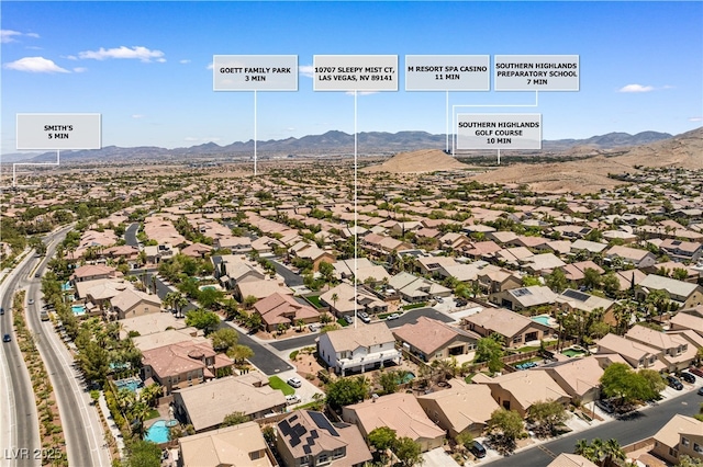 10707 Sleepy Mist Ct, Las Vegas, NV 89141 - aerial perspective of suburban area with a mountain backdrop