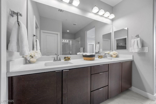 635 Pyrite Will St, Las Vegas, NV 89138 - full bath featuring a stall shower, double vanity, and tile patterned flooring