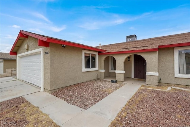 3908 Longfellow St, Las Vegas, NV 89115 - view of front of property featuring stucco siding, a garage, concrete driveway, and a porch