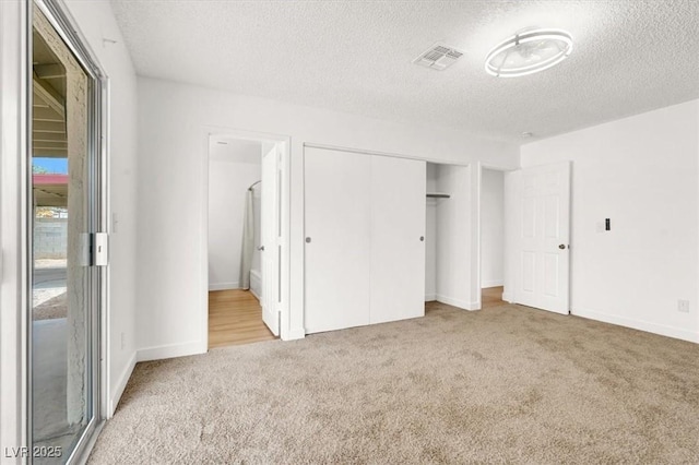 3908 Longfellow St, Las Vegas, NV 89115 - unfurnished bedroom with carpet flooring, a textured ceiling, and a closet