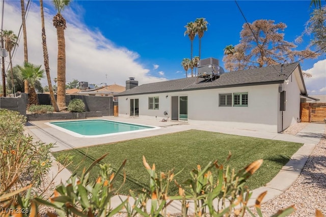 1712 E Oakey Blvd, Las Vegas, NV 89104 - back of property featuring stucco siding, a fenced backyard, a patio, and a shingled roof