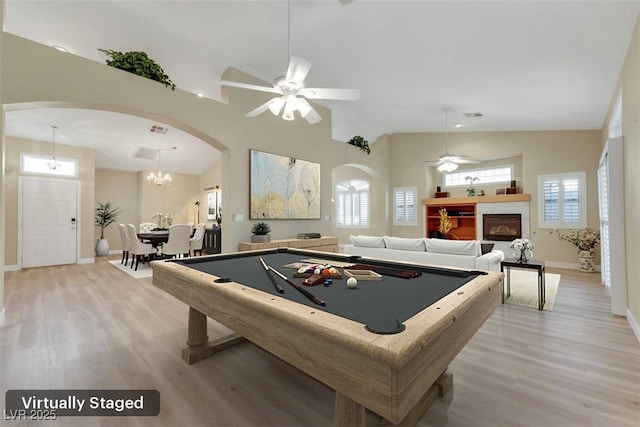 1078 Broomfield Dr, Henderson, NV 89074 - playroom with arched walkways, light wood-style flooring, healthy amount of natural light, a ceiling fan, and lofted ceiling