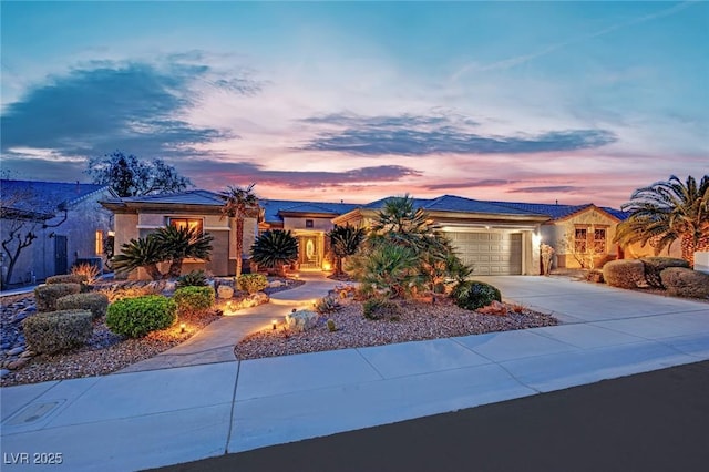 2167 Fairweather St, Henderson, NV 89052 - view of front facade featuring a garage, concrete driveway, and stucco siding