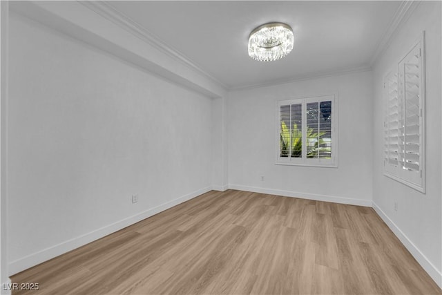 2167 Fairweather St, Henderson, NV 89052 - spare room with a chandelier, light wood-type flooring, and crown molding