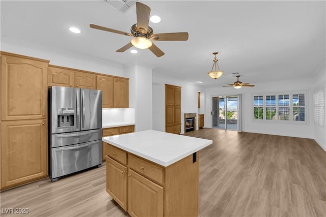 2167 Fairweather St, Henderson, NV 89052 - kitchen featuring stainless steel fridge, ceiling fan, light wood-style floors, light countertops, and recessed lighting