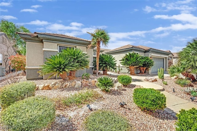2167 Fairweather St, Henderson, NV 89052 - view of front facade featuring an attached garage and stucco siding