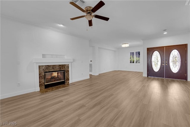 2167 Fairweather St, Henderson, NV 89052 - unfurnished living room featuring a ceiling fan, a fireplace, ornamental molding, light wood-style flooring, and recessed lighting
