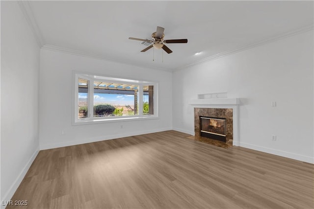 2167 Fairweather St, Henderson, NV 89052 - unfurnished living room featuring a fireplace, wood finished floors, ornamental molding, and ceiling fan