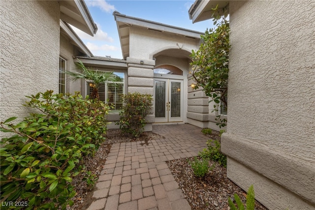 9208 Brilliant Ore Dr, Las Vegas, NV 89143 - view of exterior entry with french doors and stucco siding