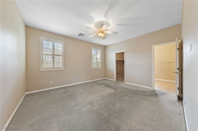 9208 Brilliant Ore Dr, Las Vegas, NV 89143 - unfurnished bedroom featuring carpet floors, a walk in closet, ceiling fan, a closet, and connected bathroom