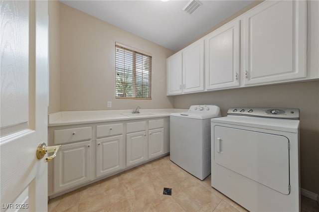 9208 Brilliant Ore Dr, Las Vegas, NV 89143 - laundry area featuring washer and dryer, cabinet space, and light tile patterned flooring
