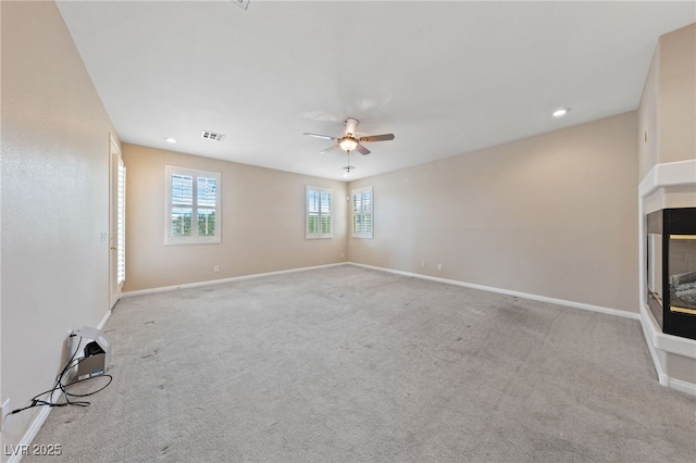 9208 Brilliant Ore Dr, Las Vegas, NV 89143 - carpeted empty room featuring ceiling fan, a multi sided fireplace, and recessed lighting
