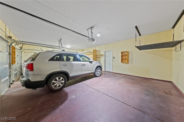 9208 Brilliant Ore Dr, Las Vegas, NV 89143 - garage with a garage door opener and baseboards