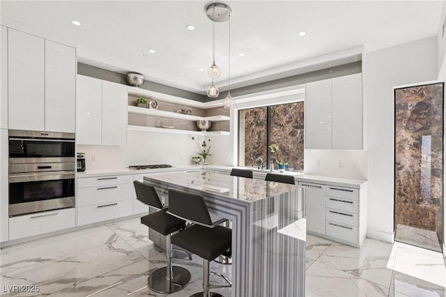 426 Tranquil Peak Ct, Henderson, NV 89012 - kitchen with modern cabinets, open shelves, a kitchen bar, and recessed lighting