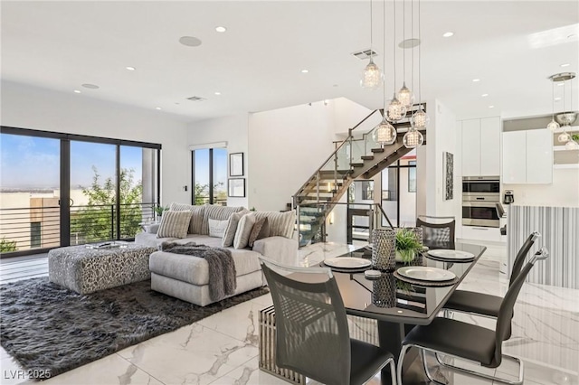 426 Tranquil Peak Ct, Henderson, NV 89012 - dining area featuring light marble finish flooring, stairs, and recessed lighting