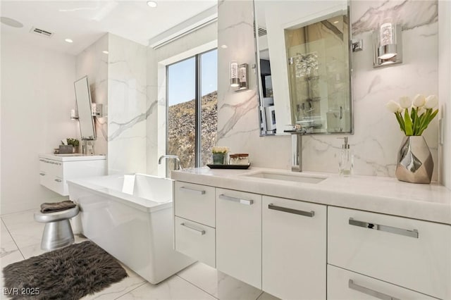 426 Tranquil Peak Ct, Henderson, NV 89012 - bathroom featuring vanity, marble finish flooring, a bath, recessed lighting, and a marble finish shower
